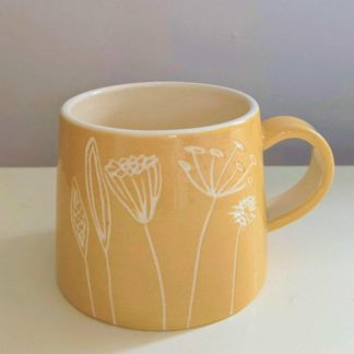 Yellow Seed Head Mug is handmade by Nick and Gabi Ward Ceramics in Herefordshire.